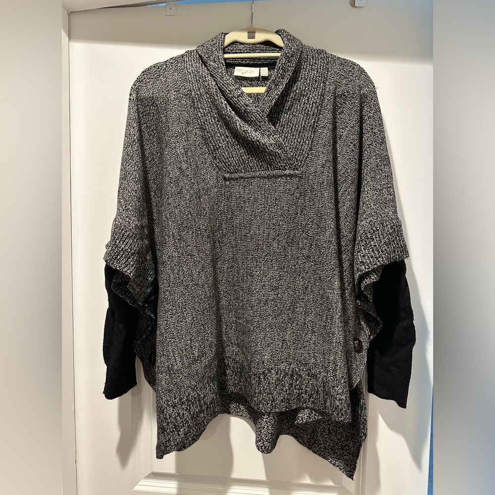 From Stitch Fix - black, gray, and white poncho with sleeves and buttons detail